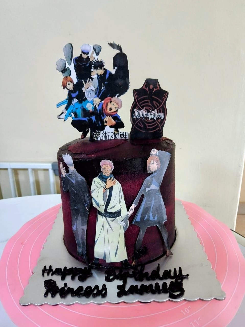 Dark themed cake with character toppers